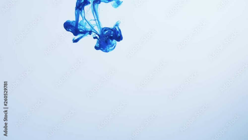 Blue ink drop in water in slow motion