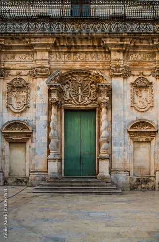Old wooden door of the cathedral in the historic center of Ortigia island in Syracuse  Sicily  Italy