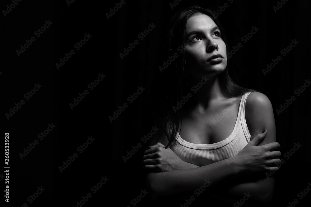 young adult sexy woman in a white tank top young adult sexy woman in a white tank top