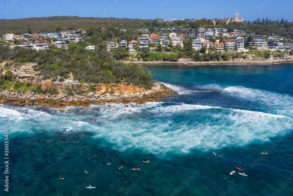 Aerial view of surfers at Shelly beach in Manly, Sydney, Australia