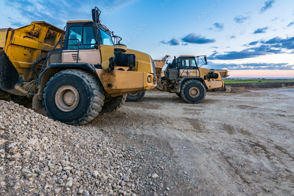 Large trucks in an open pit mine Large trucks in an open pit mine