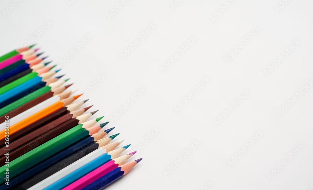 Colored pencils on a white background, with space for your text, blank for banner Colored pencils on a white background, with space for your text, blank for banner