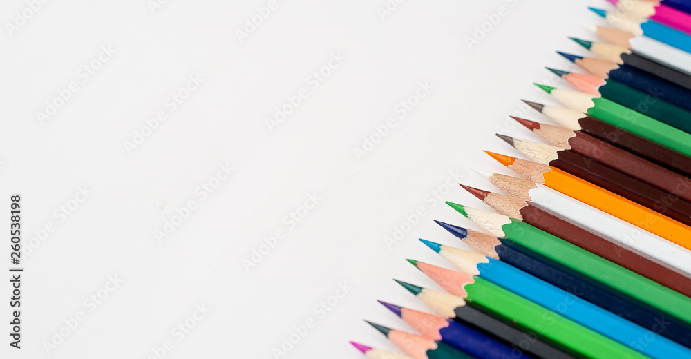 Colored pencils on a white background, with space for your text, blank for banner Colored pencils on a white background, with space for your text, blank for banner