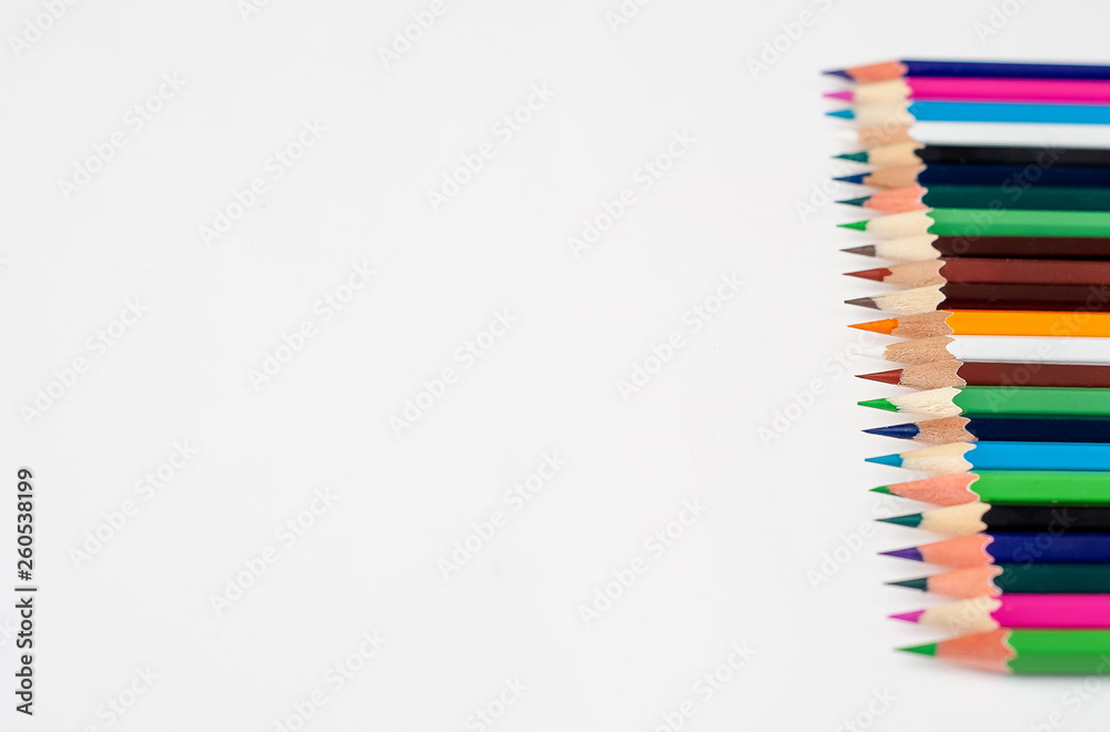 Colored pencils on a white background, with space for your text, blank for banner Colored pencils on a white background, with space for your text, blank for banner