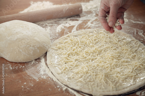 A man is cooking pizza. The cooking process.