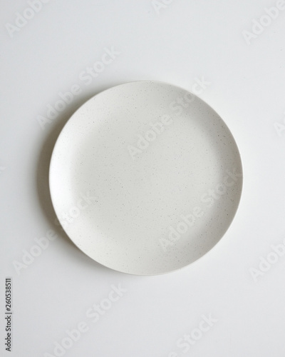 White ivory plate . Festive table setting for holiday. On a white background  from above. Top view. Tableware. Isolated.