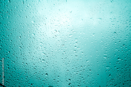 water drops on blue background / Drops of rain on glass , rain drops on clear window / Blue Abstract Water Drops Background / water drops on glass surface as background.