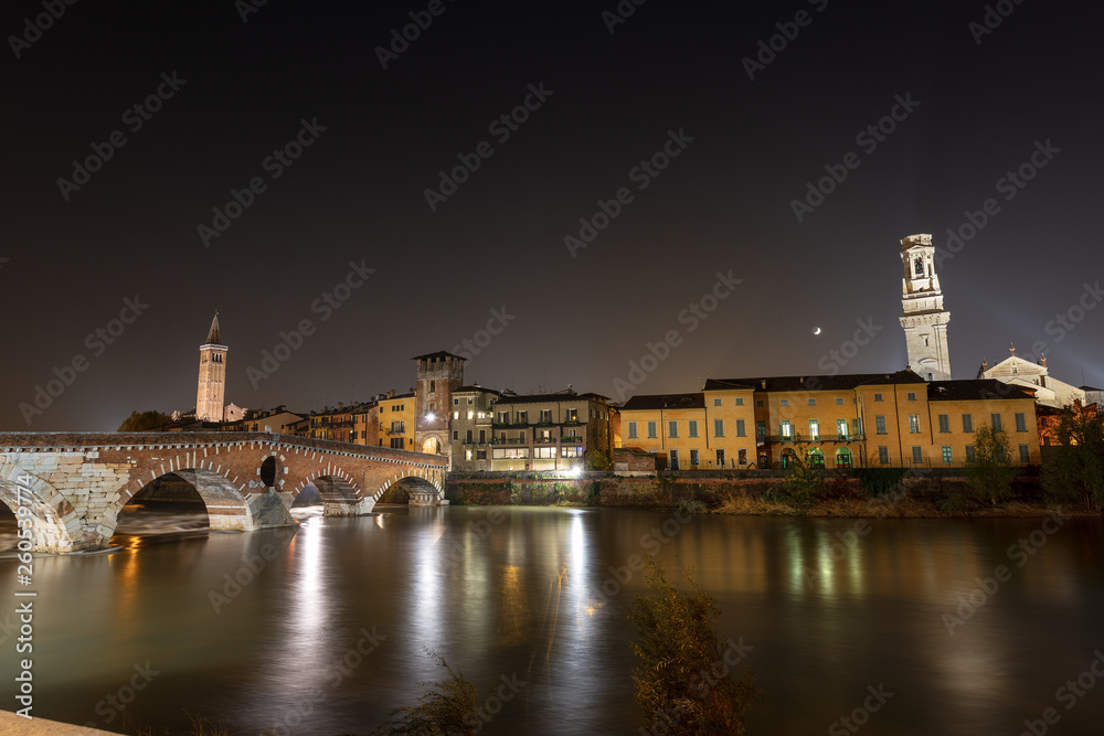Ponte Pietra and Adige River at night - Verona Italy