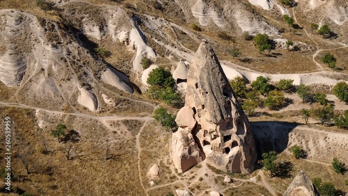 fabulos natural volcanick eroded formation with created cave houses at sunny day. Goreme open park,Cappadocia,turkey photo