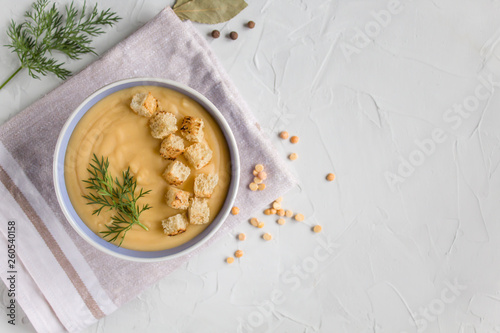 pea cream soup with croutons on a light background. The view from the top . Copy space