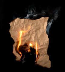 .burning piece of crumpled paper