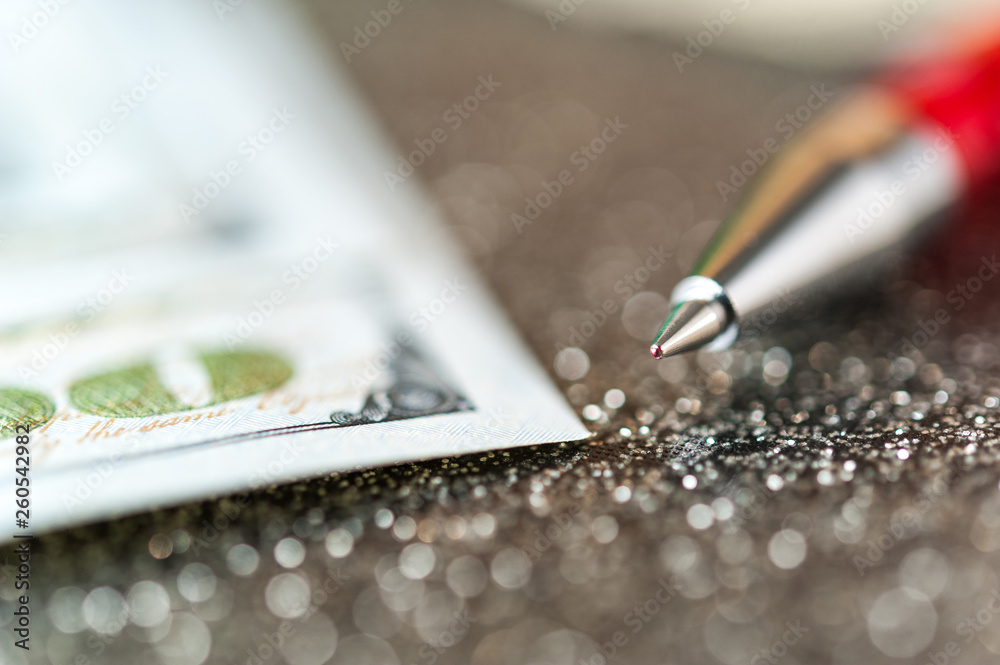 Business and financial background with dollars and pen. Abstract bookkeeping background. Business and financial background with dollars and pen. Abstract bookkeeping background.