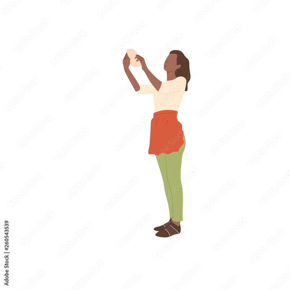 The girl in the apron wipes the dust. The girl in the apron wipes the dust.