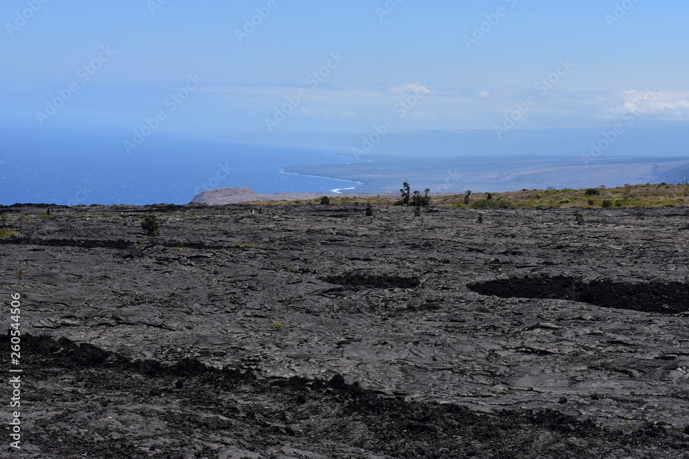 Old Lava field running into the sea sharp cliffs eroded over time from the crash of the surf