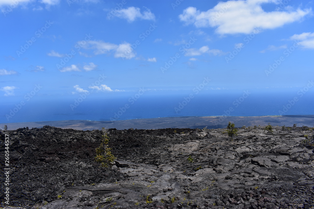 Old Lava field running into the sea sharp cliffs eroded over time from the crash of the surf