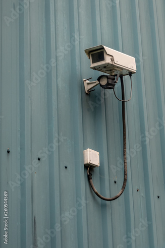 Security camera on the side of a commercial unit