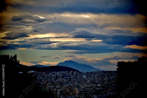 beautiful view down on the city, clouds and mountains © Tania