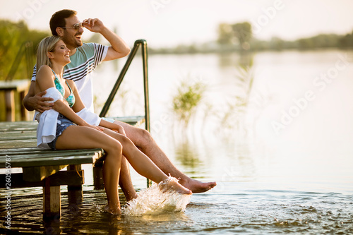 Loving couple sitting on th...