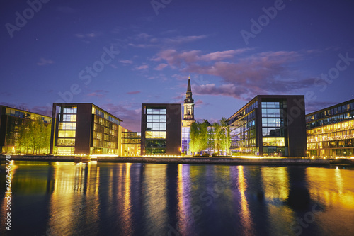 Modern buildings on the bank of the canal at night. Copenhagen  Denmark. 
