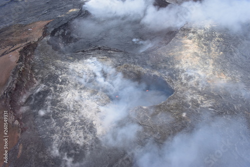 Arial View of Mauna Loa Volcano Crater Hawaii smoke rising from the crater as it is errupting