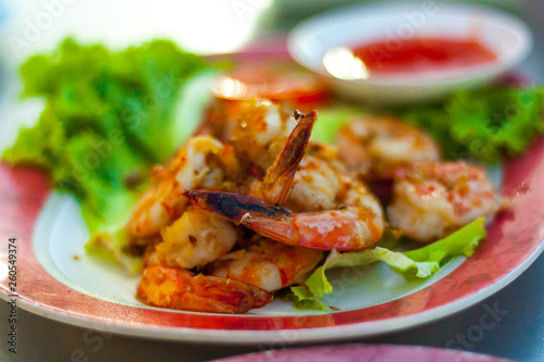 Thai food famous menu "Goong Tod Kra Thiam Phrik Thai" or Stir fried shrimp with garlic. Thai food.