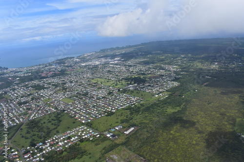 Arial view of Hilo Hawaii from a helicopter urban city seen from above the clouds Tourist location