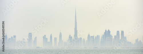 Photography Stunning panoramic view of the Dubai skyline with the magnificent Burj Khalifa and many others towers, skyscrapers and buildings surrounded by a thick morning fog
