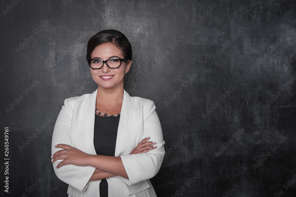 Happy smiling teacher with eyeglasses on blackboard Happy smiling teacher with eyeglasses on blackboard