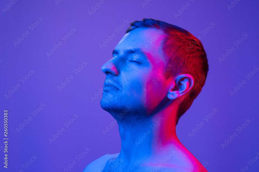 portrait of a man in multicolored light