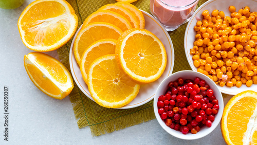 Oranges and sea buckthorn on the table. View from above