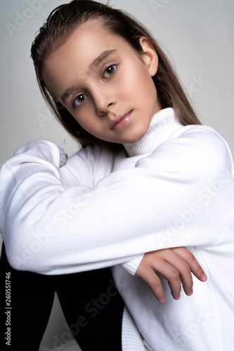 Quadro em tela Portrait of a cute teen girl wearing a white turtleneck sweater