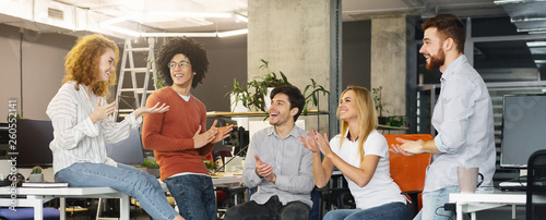 Group multiethnic business people applauding to new member of team