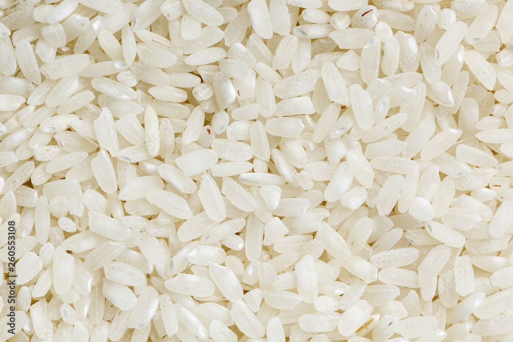 White rice background and texture. Rice grain. View from above. Close-up