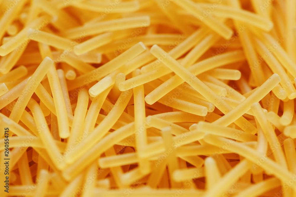 Background texture and pattern of boiled egg noodles or spaghetti pasta in full-frame format. View from above. Close-up Background texture and pattern of boiled egg noodles or spaghetti pasta in full-frame format. View from above. Close-up