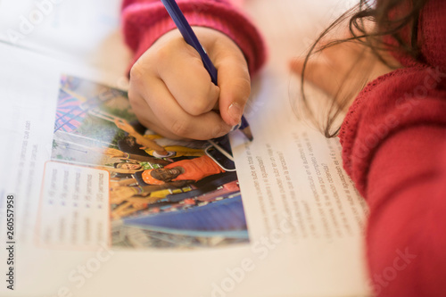 Ten year old girl going homework photo