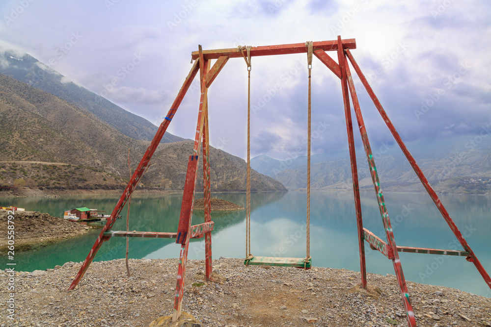 Fototapeta premium Swing with tortum lake view in Uzundere, Erzurum, Turkey