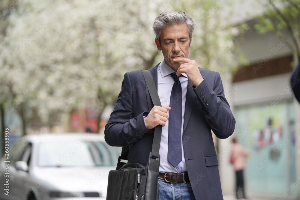 Buisnessman commuting on foot in European city Buisnessman commuting on foot in European city