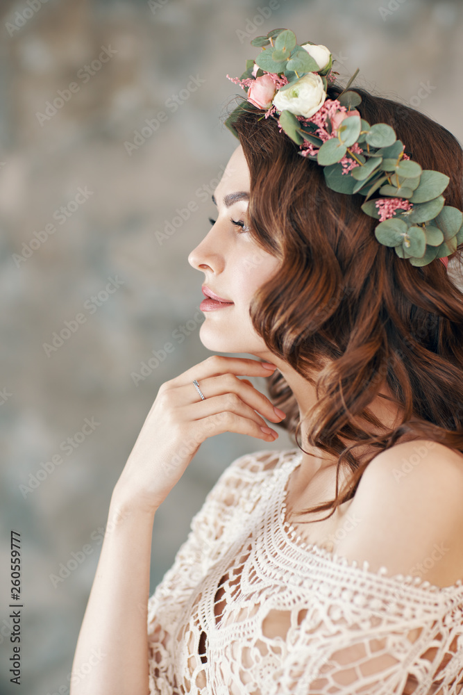 Beauty profile portrait of young woman with wreath of flowers in her hair. Beauty profile portrait of young woman with wreath of flowers in her hair.