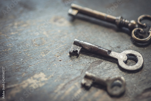 Shallow DOF. Set of vintage worn out keys on a wooden background. © Room 76 Photography