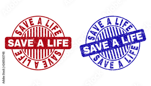 Grunge SAVE A LIFE round stamp seals isolated on a white background. Round seals with grunge texture in red and blue colors.