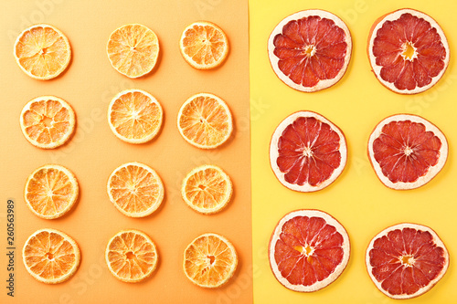 Dried citrus fruits on colorful background