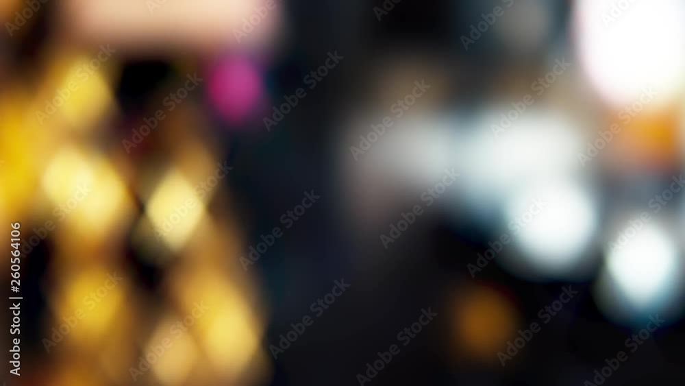 Blurred image of the interior of the restaurant. Defocused people with different activities. A glass of wine or cocktail with a slice of pineapple in the foreground. Blurred image of the interior of the restaurant. Defocused people with different activities. A glass of wine or cocktail with a slice of pineapple in the foreground.