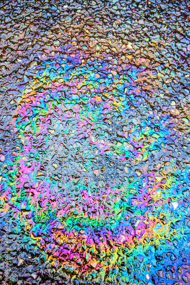 Obraz premium Oil Petrol Pollution Rainbow Spill on A Road
