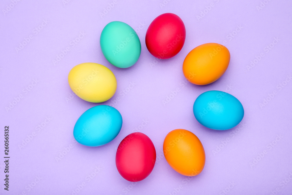 Colorful easter eggs on purple background