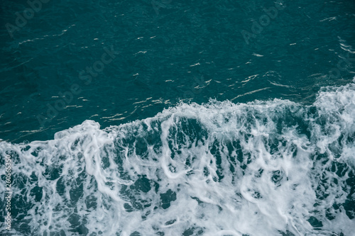 Close view of rough sea ,Beautiful blue ocean water and waves © pariwatpannium