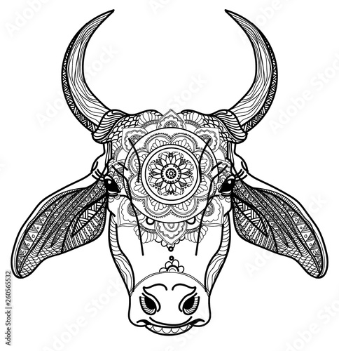 The cow's head. A cow with big horns and fluffy ears. Drawing manually in vintage style. Meditative coloring. Coloring for children. Arrows, points, patterns, waves.