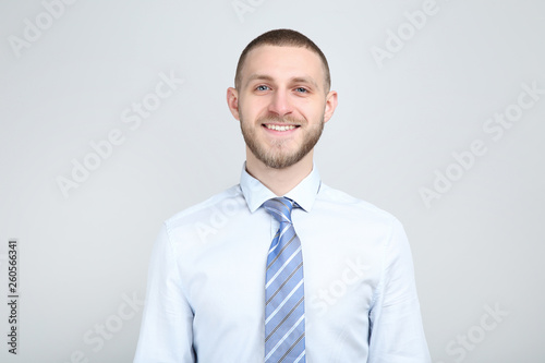 Portrait of young man on grey background