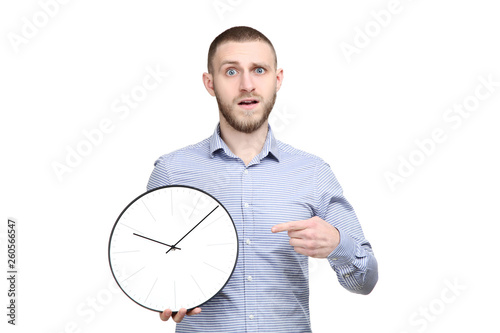 Portrait of young man with round clock on white hbackground photo