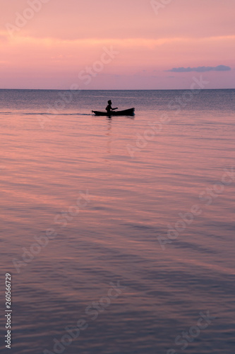 beautiful sunset on the beach and silhouette boat, Samui island  Thailand © pariwatpannium