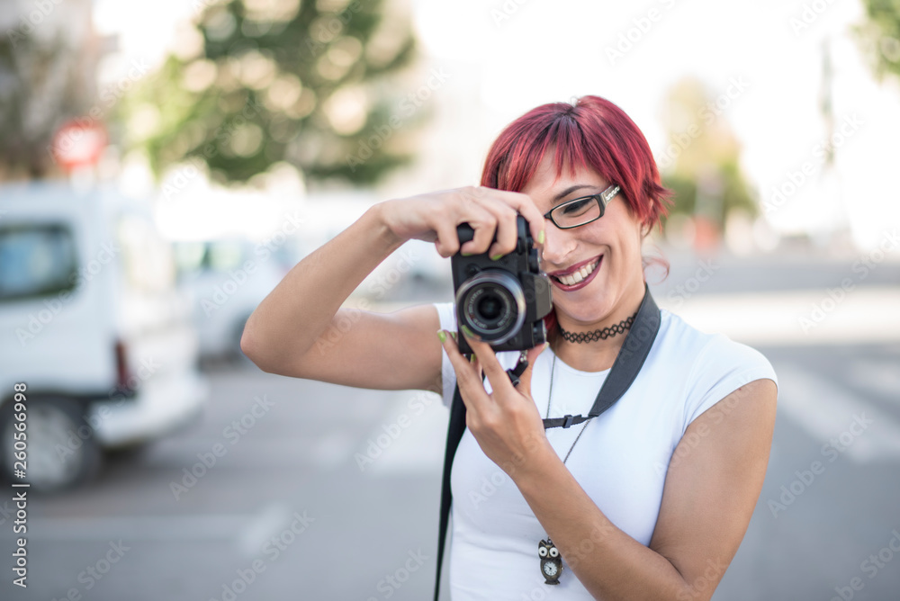 Woman taking photo with mirrorless